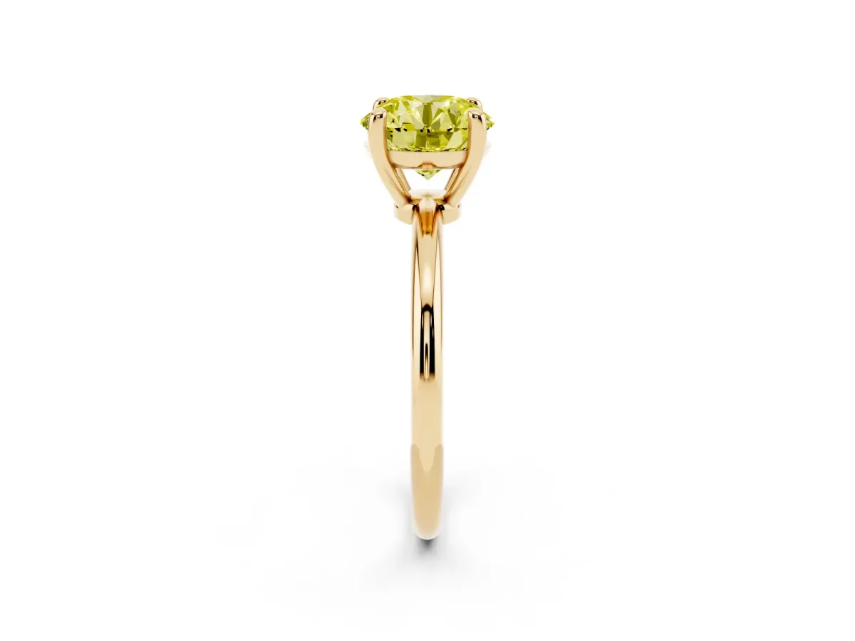 Fancy Yellow Round Cut Solitaire Diamond Ring with 4-Prong Setting on a Classic Band Yellow gold
