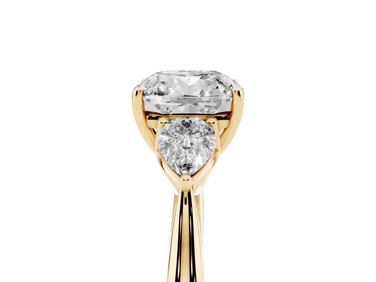 Three-Stone Cushion Cut Brilliant Diamond Solitaire Ring with Tapered Band and Four-Prong Setting Yellow gold