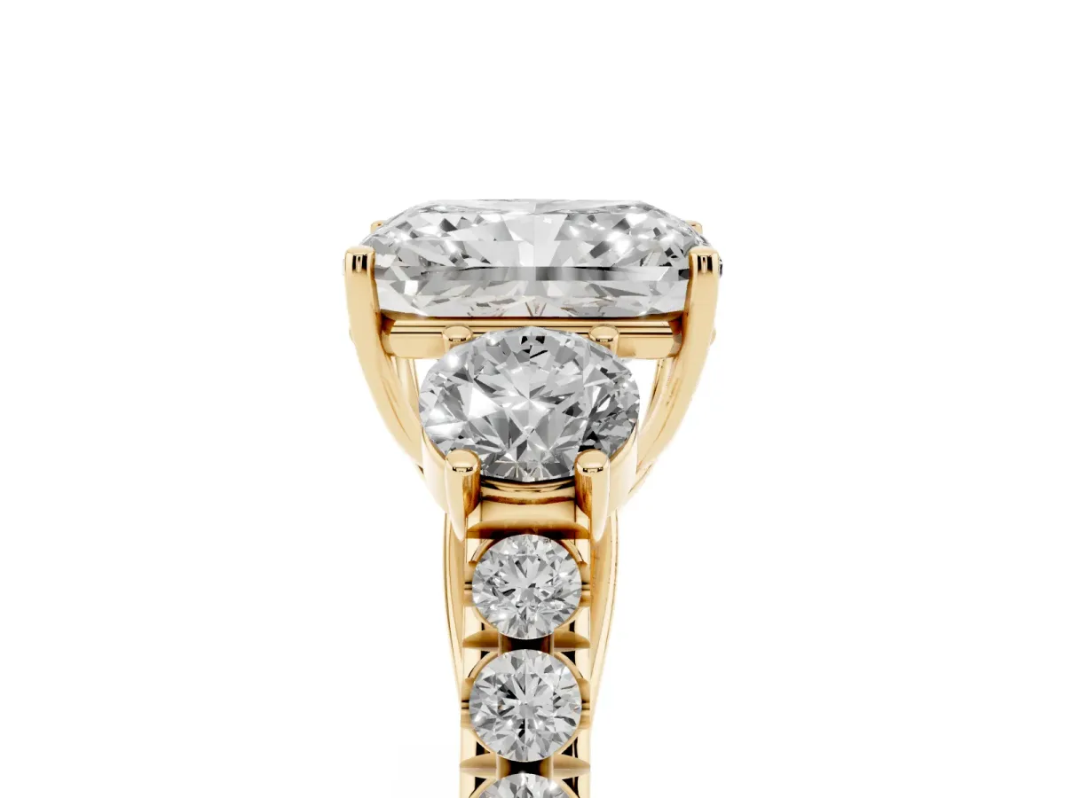 Radiant Cut Cut Diamond Three-Stone Ring with Round Side Stones and Pavé Band Yellow gold