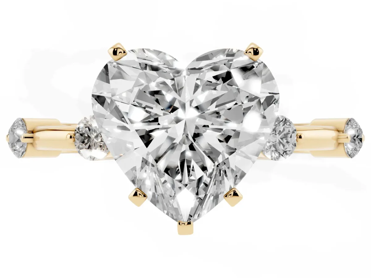 Heart Cut Solitaire Diamond Ring with Bezel Set Side Stones and Prong Setting Yellow gold