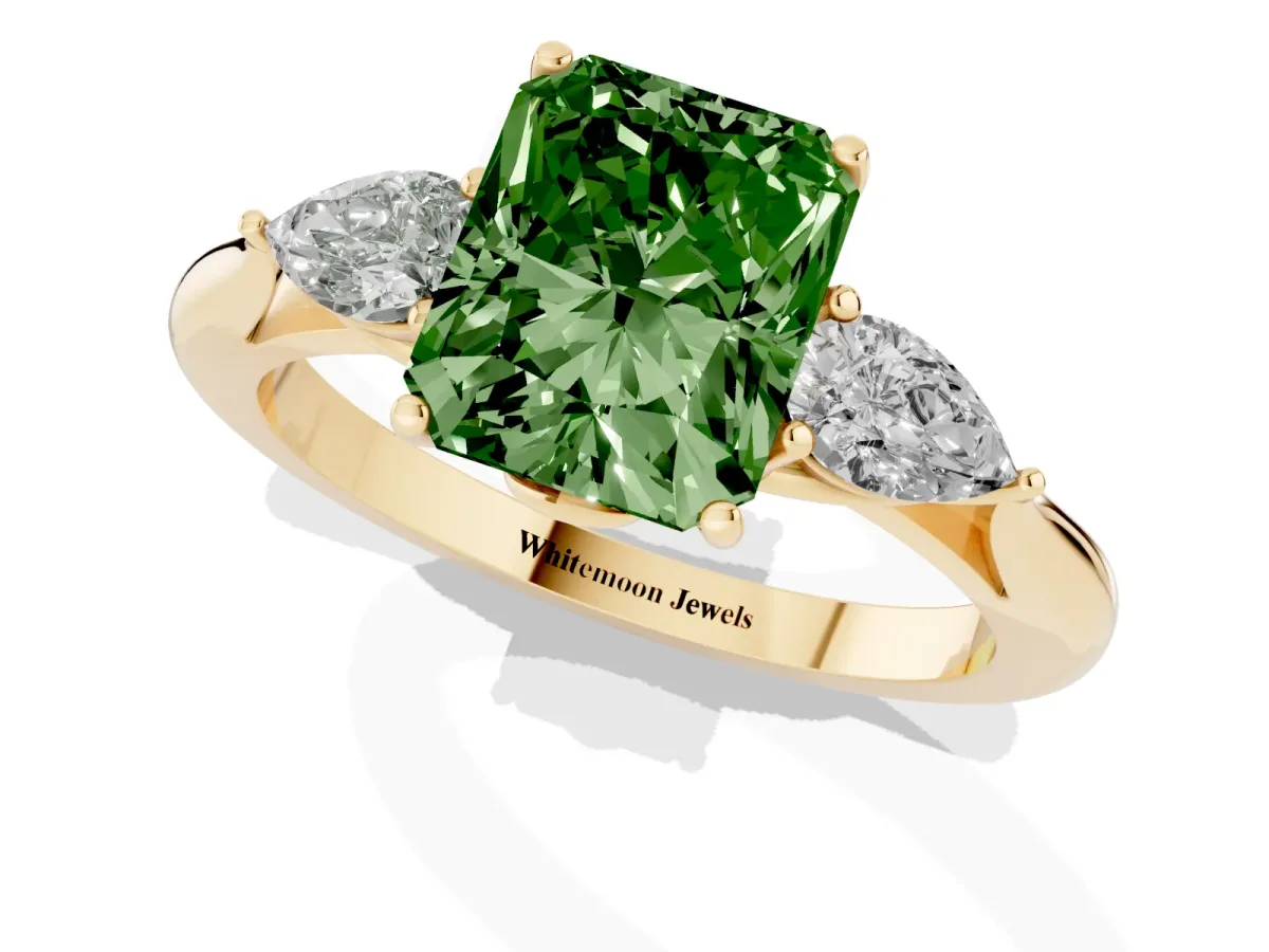 Fancy Green Radiant Cut Diamond Three-Stone Ring with Pear Side Stones and Prong Setting Yellow gold