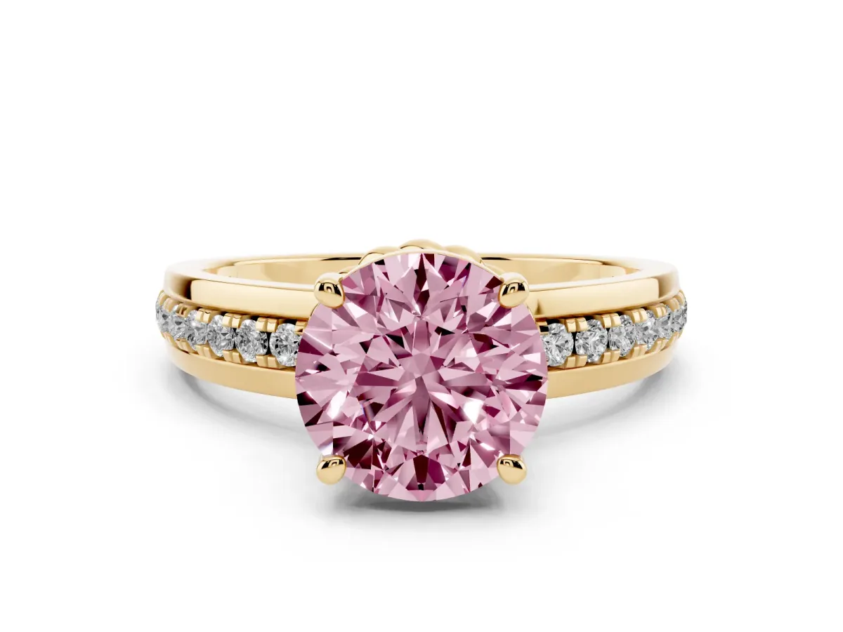 Fancy Pink Round Cut Solitaire Diamond Ring with Channel Set Band and Six-Prong Setting Yellow gold