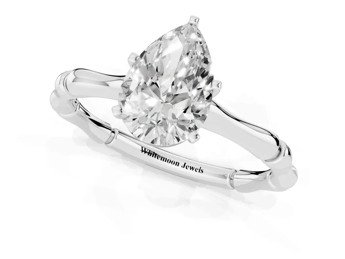 Pear Cut Solitaire Diamond Ring with Bamboo Band and Four-Prong Setting Platinum