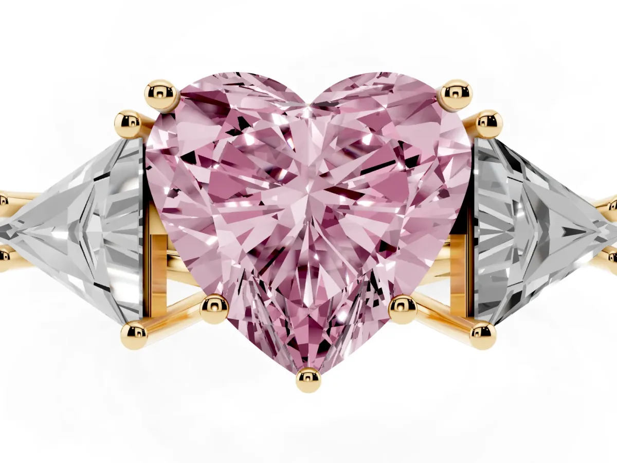 Fancy Pink Three-Stone Heart Cut Diamond Engagement Ring with Trillion Side Stones and Prong Setting Yellow gold