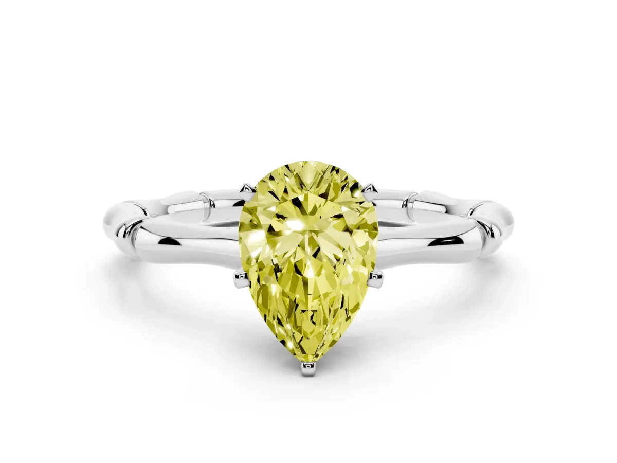 Fancy Yellow Pear Cut Solitaire Diamond Ring with Bamboo Band and Four-Prong Setting Silver