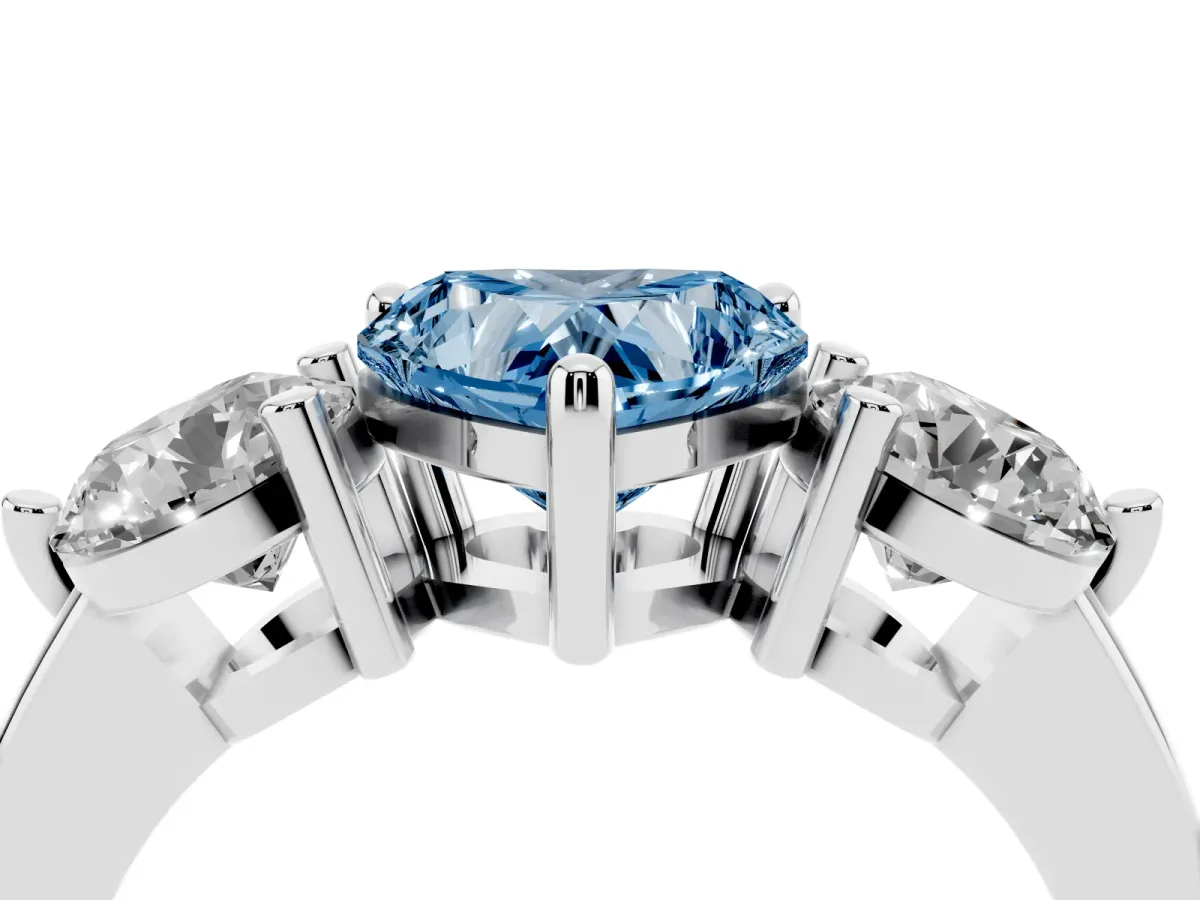 Fancy Blue Three-Stone Heart Cut Brilliant Cut Solitaire Ring with Prong Setting on a Classic Band Silver