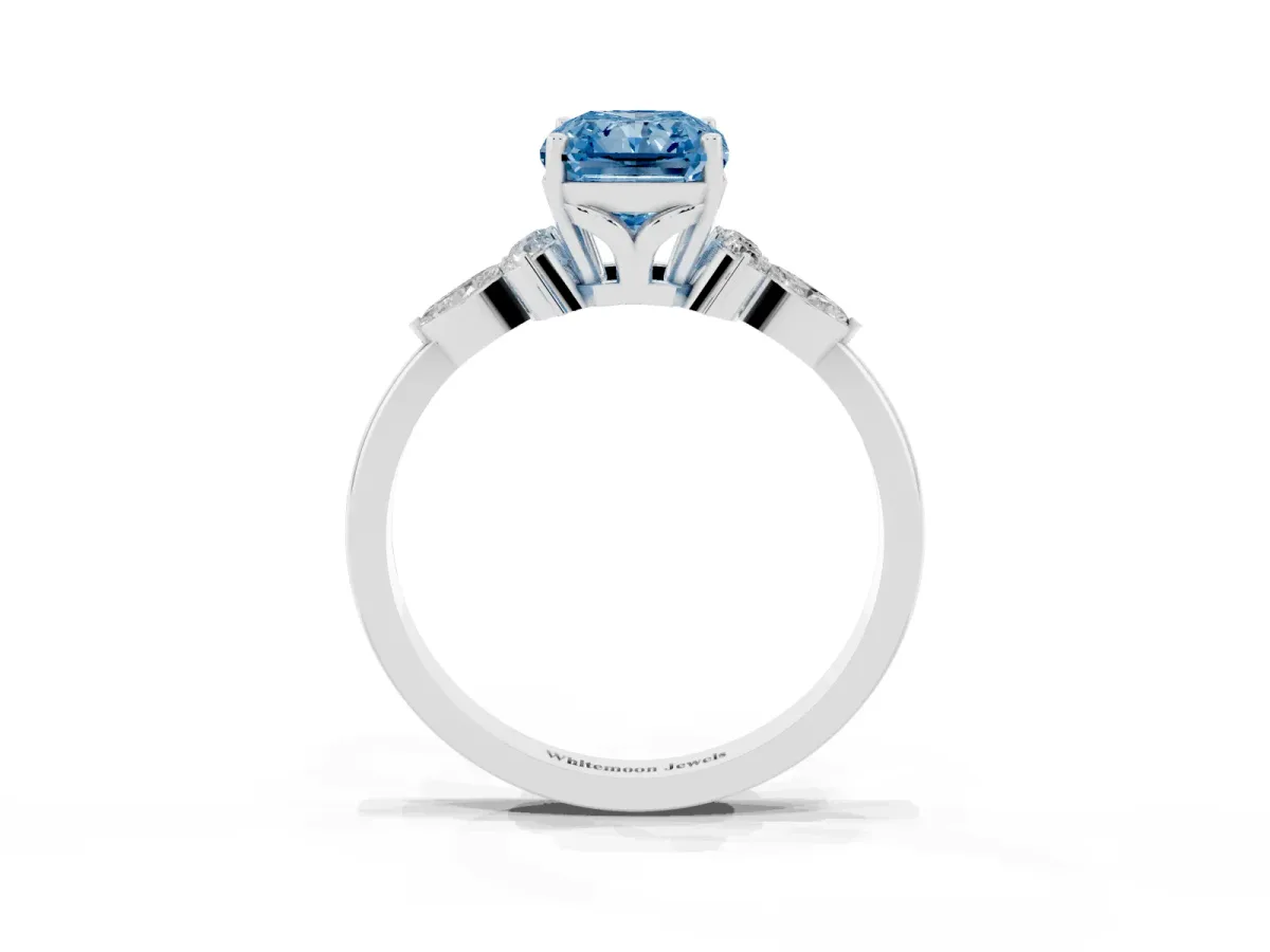 Fancy Blue Radiant Cut Brilliant Diamond Solitaire Ring with Pear Side Stones and Four-Prong Setting Silver