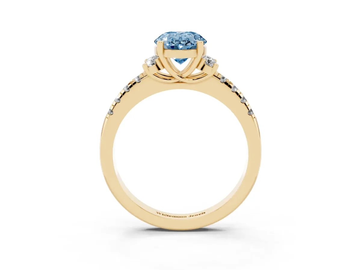 Fancy Blue Oval Cut Diamond Three-Stone Pave Band with Four-Prong Setting Yellow gold