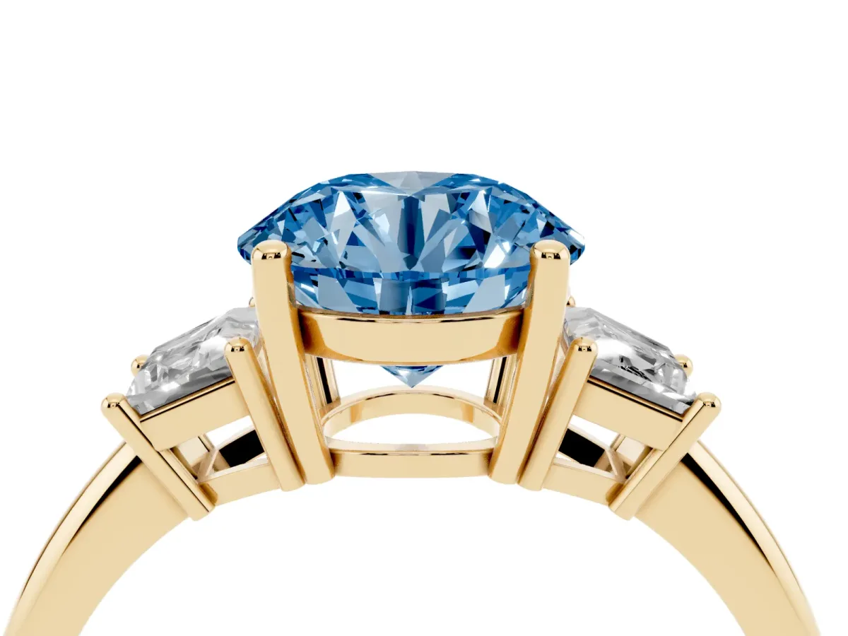 Fancy Blue Round Cut Diamond Three-Stone Ring with Trapezoid Side Stones and Prong Setting Yellow gold
