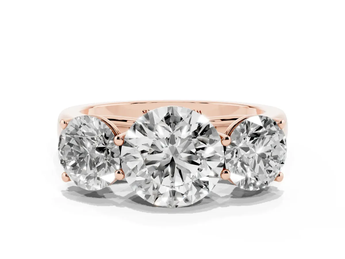 Round Cut Three-Stone Diamond Ring with Prong Setting on a Classic Band Rose gold
