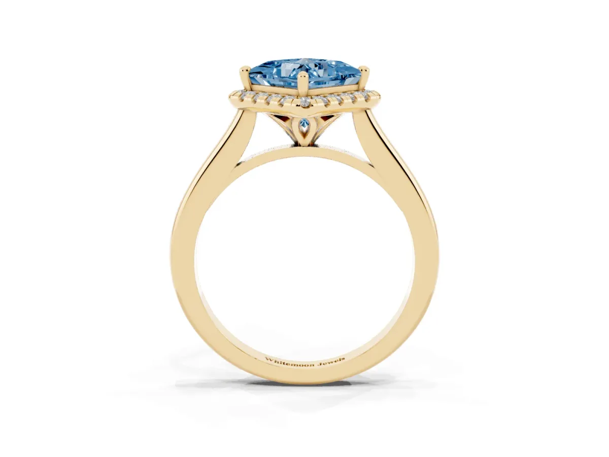 Fancy Blue Princess Cut Halo Round Diamond Solitaire Engagement Ring with Pave Band and Four-Prong Setting Yellow gold