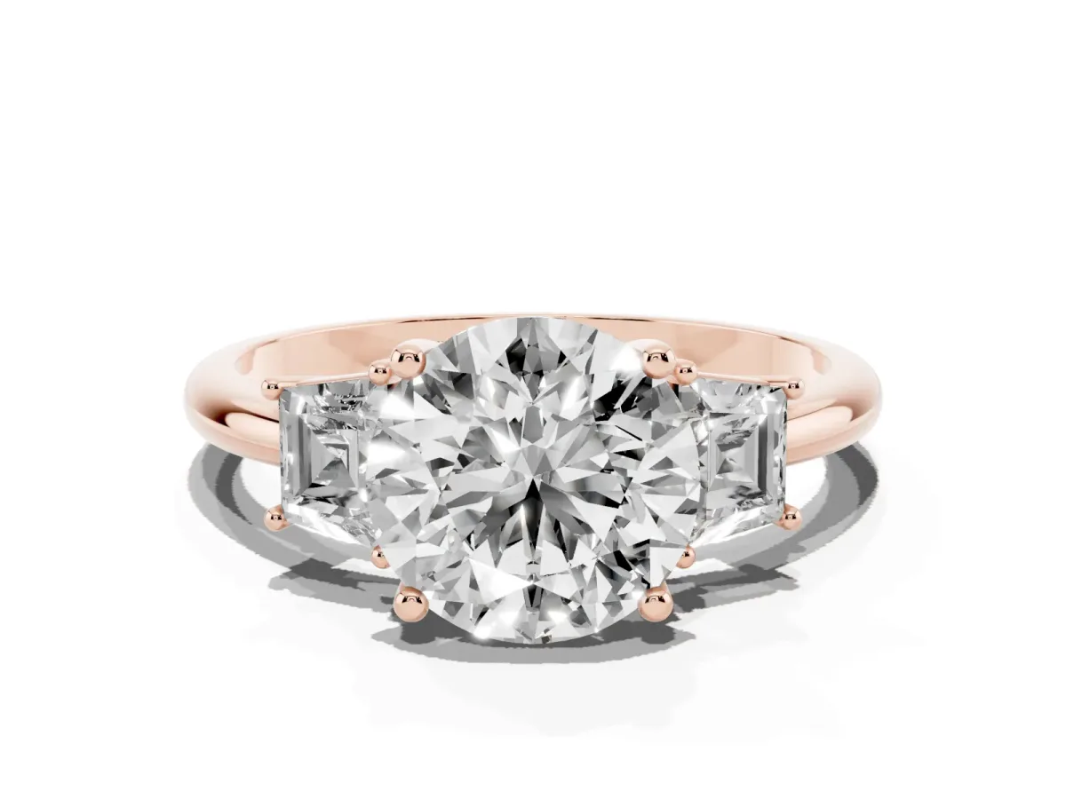 Round Cut Diamond Three-Stone Ring with Trapezoid Side Stones and Prong Setting Rose gold