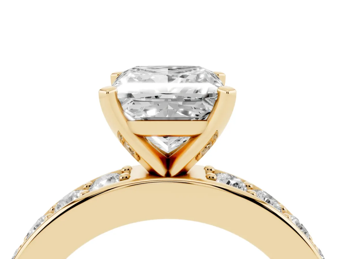 Princess Cut Diamond Engagement Ring with Channel Set Round Band and Prong Setting Yellow gold