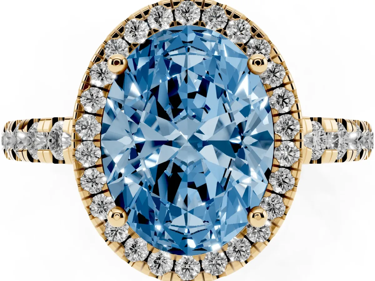 Fancy Blue Oval Cut Diamond Halo Ring with Pavé Band and Four-Prong Setting Yellow gold