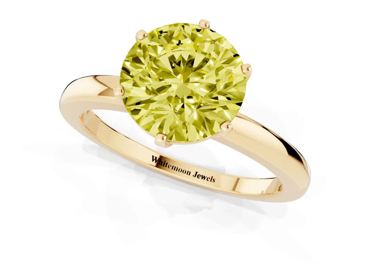 Fancy Yellow Round Cut Solitaire Diamond Ring with Six-Prong Setting on a Classic Band Yellow gold