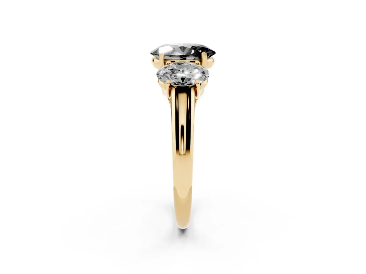 Fancy Black Three-Stone Oval Cut Diamond Engagement Ring with Prong Setting Yellow gold