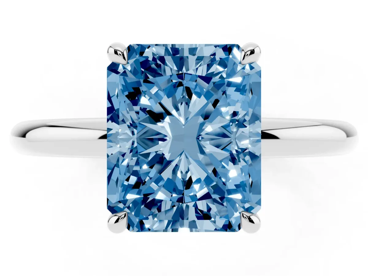 Fancy Blue Radiant Cut Diamond Solitaire Ring with Thin Band and Four-Prong Setting Silver