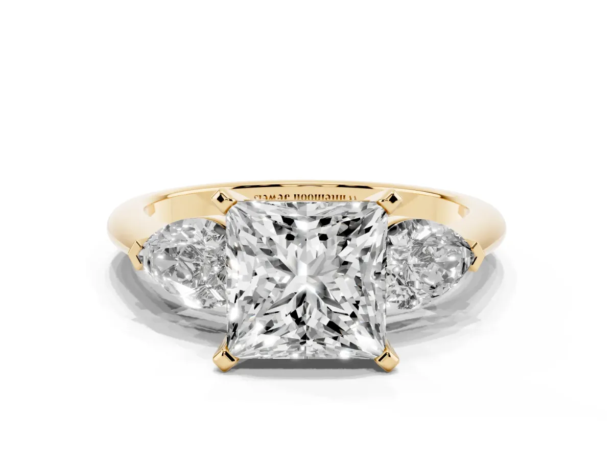 Three-Stone Princess Cut Diamond Ring with Pear Side Stones and Four-Prong Setting Yellow gold