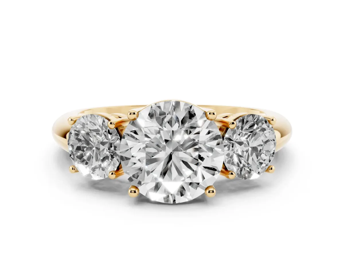 Three-Stone Round Cut Cut Diamond Engagement Ring with Prong Setting on a White Gold Band Yellow gold