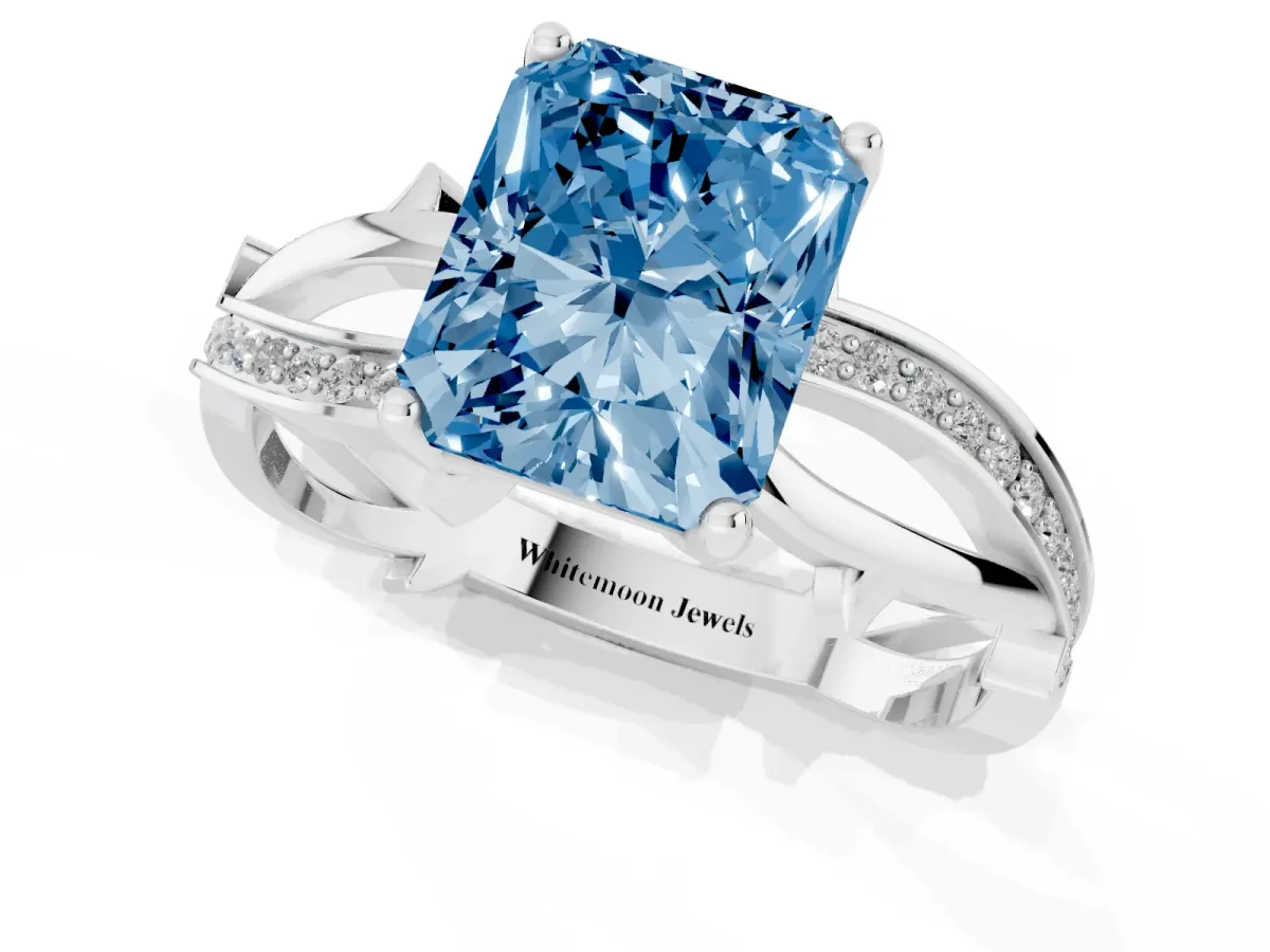 Fancy Blue Radiant Cut Solitaire Twist Band with Pavé Accents and Four-Prong Setting Silver