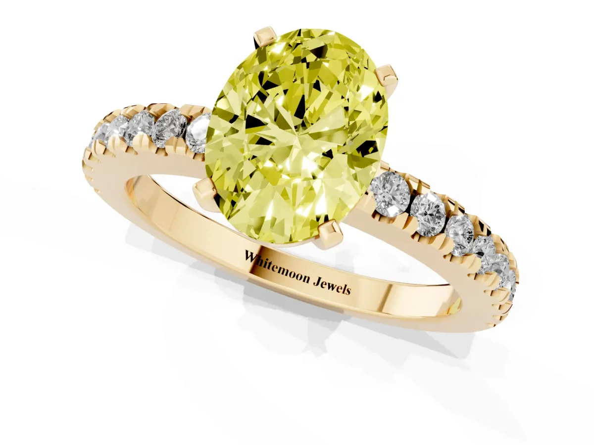 Fancy Yellow Oval Cut Solitaire Diamond with Pavé Band and Four-Prong Setting Yellow gold