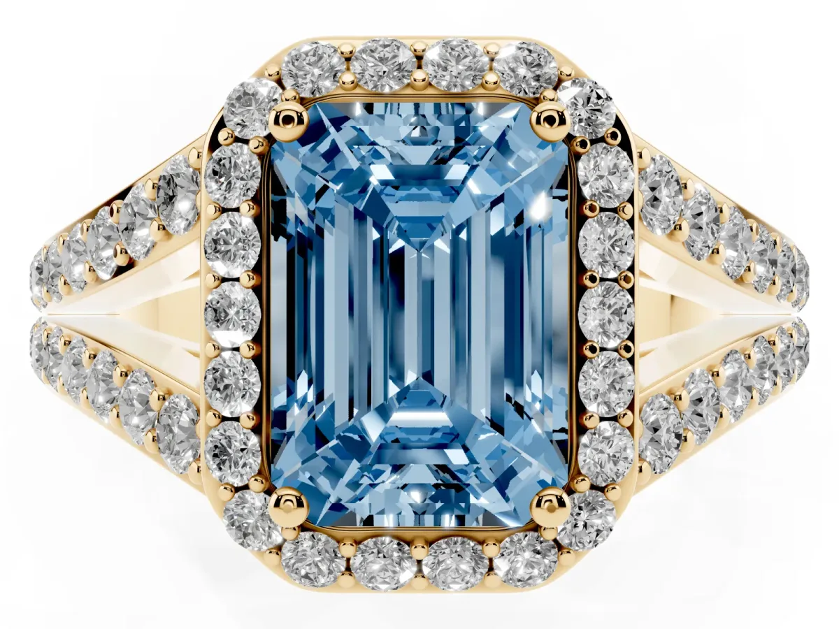 Fancy Blue Emerald Cut Diamond Split Shank Halo Ring with Four-Prong Setting Yellow gold