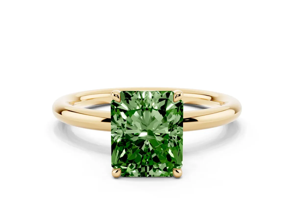 Fancy Green Radiant Cut Diamond Solitaire Ring with Thin Band and Four-Prong Setting Yellow gold