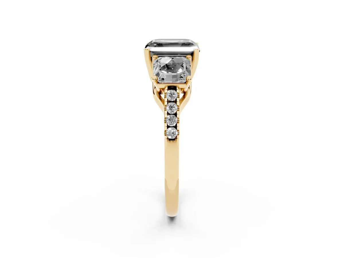Fancy Black Three-Stone Asscher Cut Diamond Ring with Round Pavé Band and Prong Setting Yellow gold