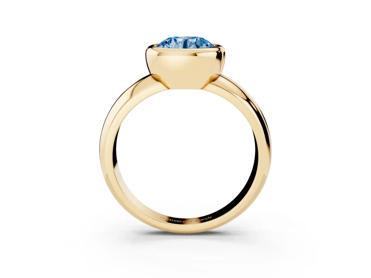 Fancy Blue Bezel Set Round Cut Solitaire Ring with Wide Band Yellow gold