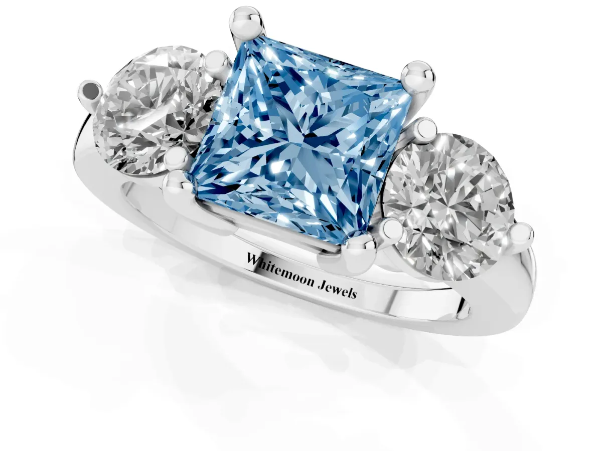 Fancy Blue Three-Stone Princess Cut Brilliant Cut Solitaire Ring with Prong Setting on a Classic Band Silver