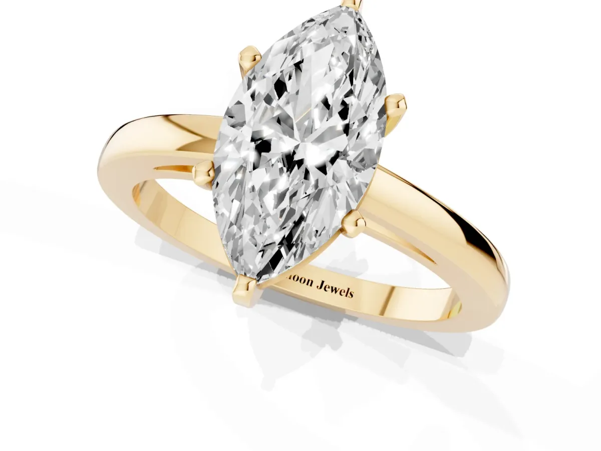 Marquise Cut Solitaire Diamond Engagement Ring with Four-Prong Setting on a Classic Band Yellow gold
