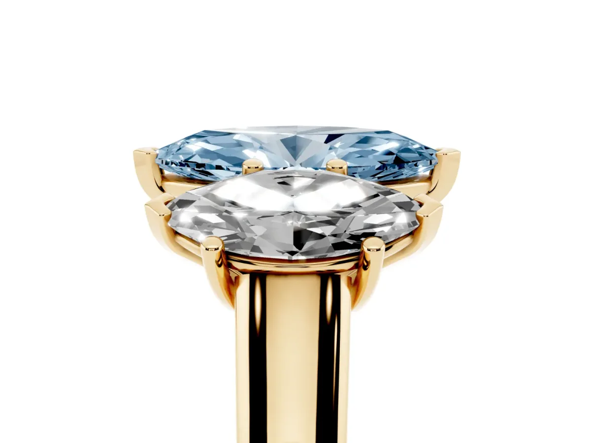 Fancy Blue Marquise Cut Three-Stone Diamond Ring with Prong Setting on a Classic Band Yellow gold