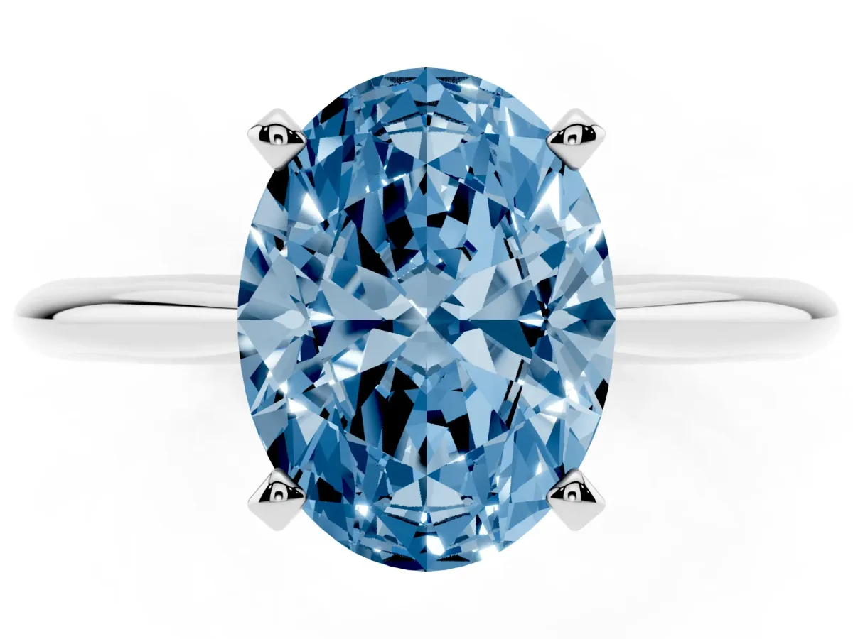 Fancy Blue Oval Cut Cut Solitaire Ring with Four-Prong Setting on a Classic Band Silver