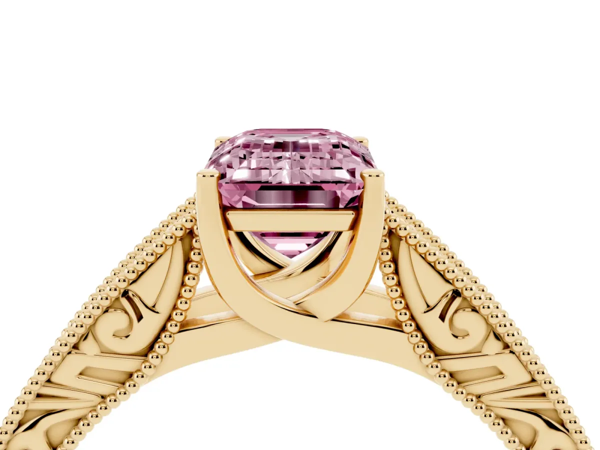 Fancy Pink Emerald Cut Diamond Solitaire Ring with Engraved Band and Four-Prong Setting Yellow gold