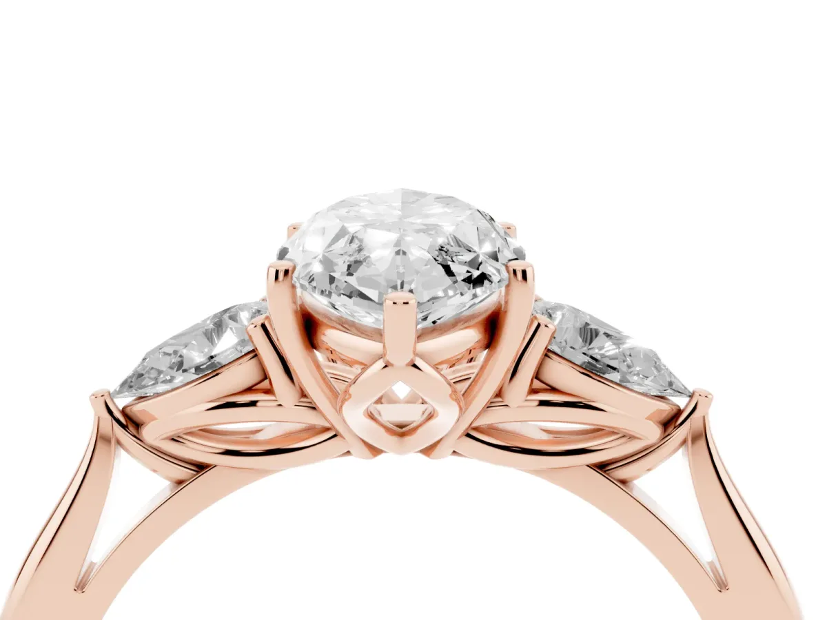 Three-Stone Marquise Cut Diamond Ring with Pear Side Stones in Four-Prong Setting Rose gold