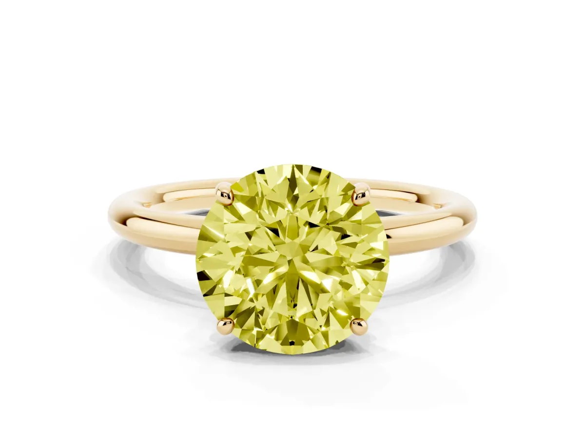 Fancy Yellow Round Cut Solitaire Diamond Ring with Four-Prong Setting on a Plain Band Yellow gold