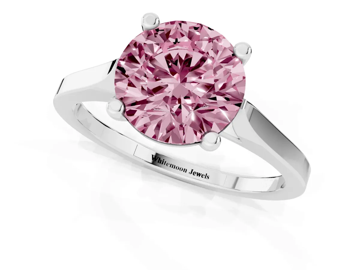 Fancy Pink Round Cut Solitaire Diamond Ring with Four-Prong Setting and Tapered Band Platinum
