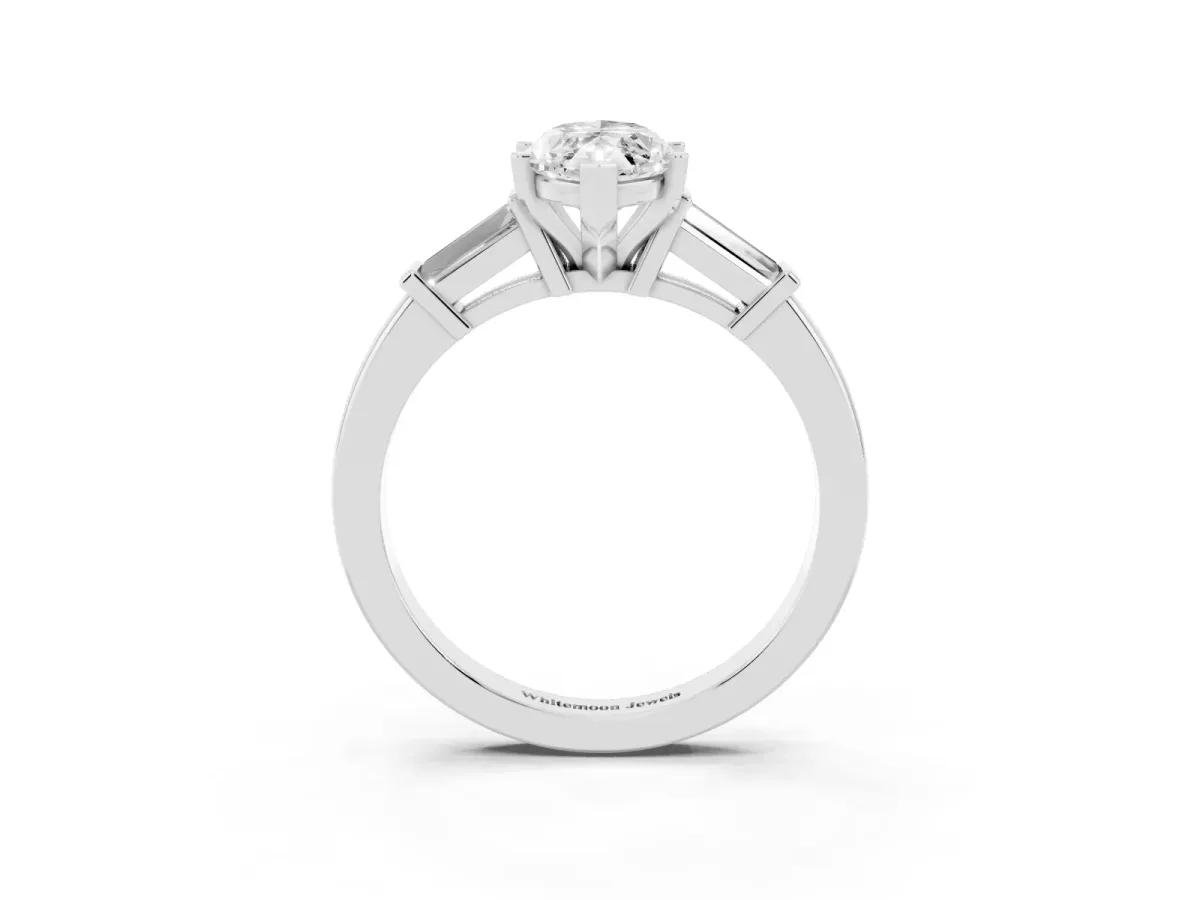 Marquise Cut Cut Diamond Solitaire Ring with Tapered Baguette Accents and Four-Prong Setting Platinum