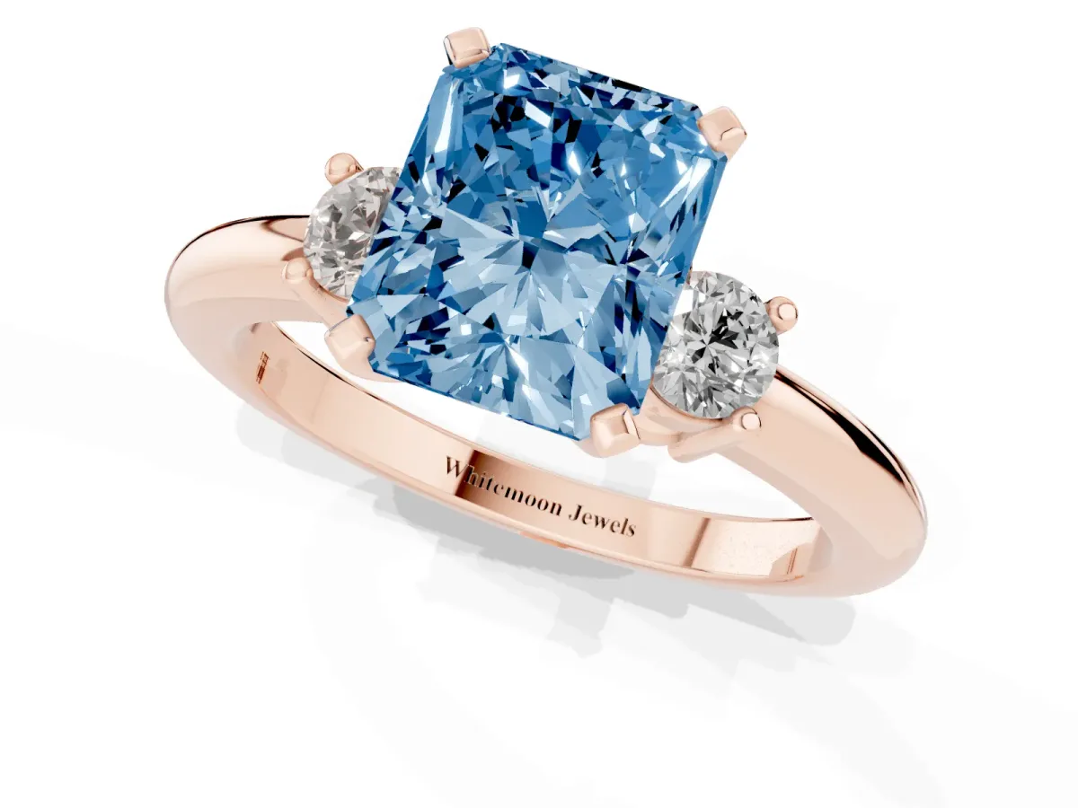 Fancy Blue Three-Stone Radiant Cut Cut Diamond Solitaire with Prong Setting and Classic Band Rose gold
