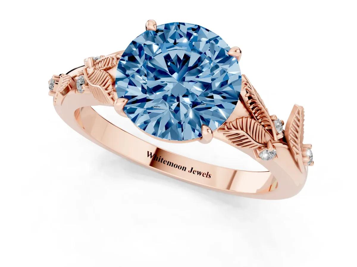 Fancy Blue Round Cut Diamond Solitaire Ring with Leaf Motif Band and Four-Prong Setting Rose gold