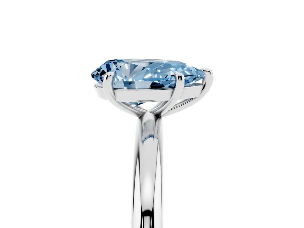 Fancy Blue Pear Cut Solitaire Diamond Ring with Four-Prong Setting on a Plain Band Silver