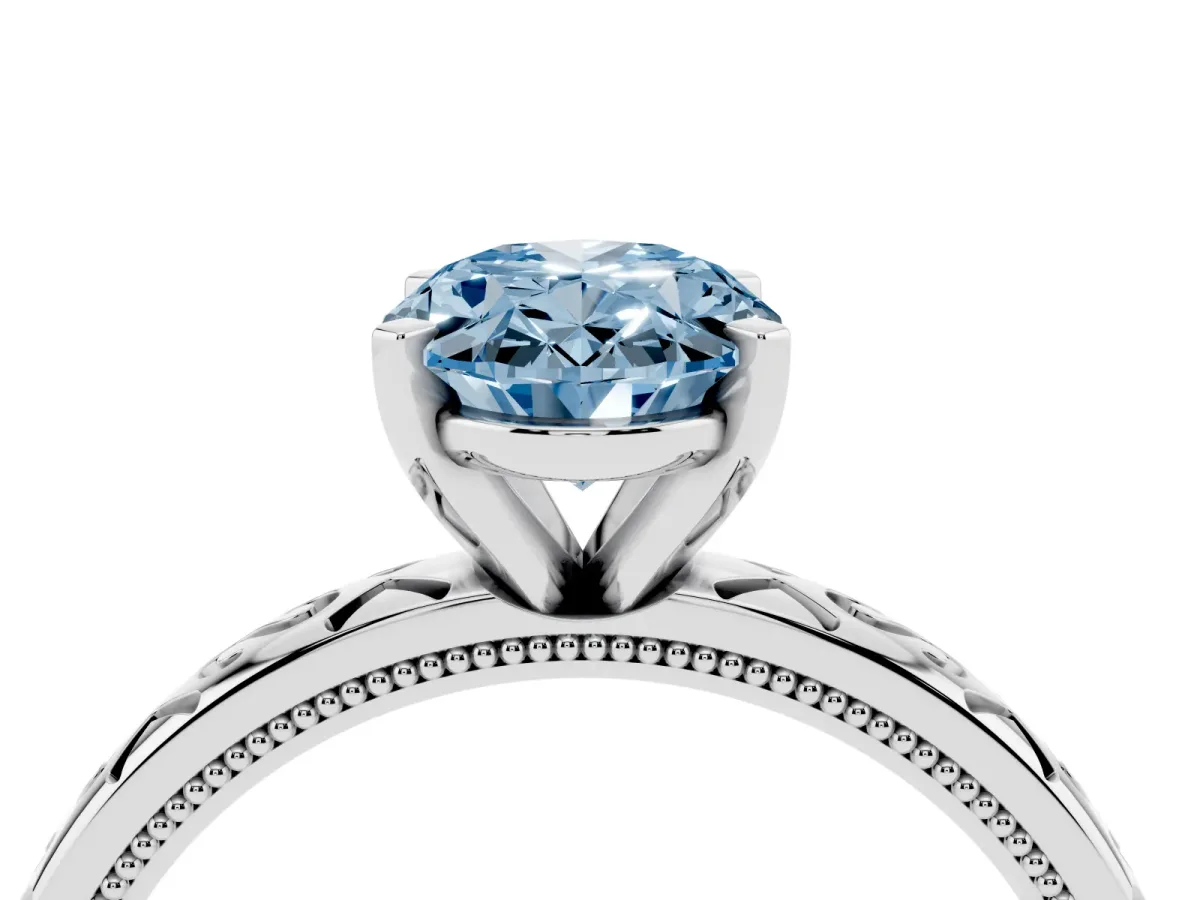 Fancy Blue Oval Cut Solitaire Engagement Ring with Scrollwork Band and Four-Prong Setting Silver