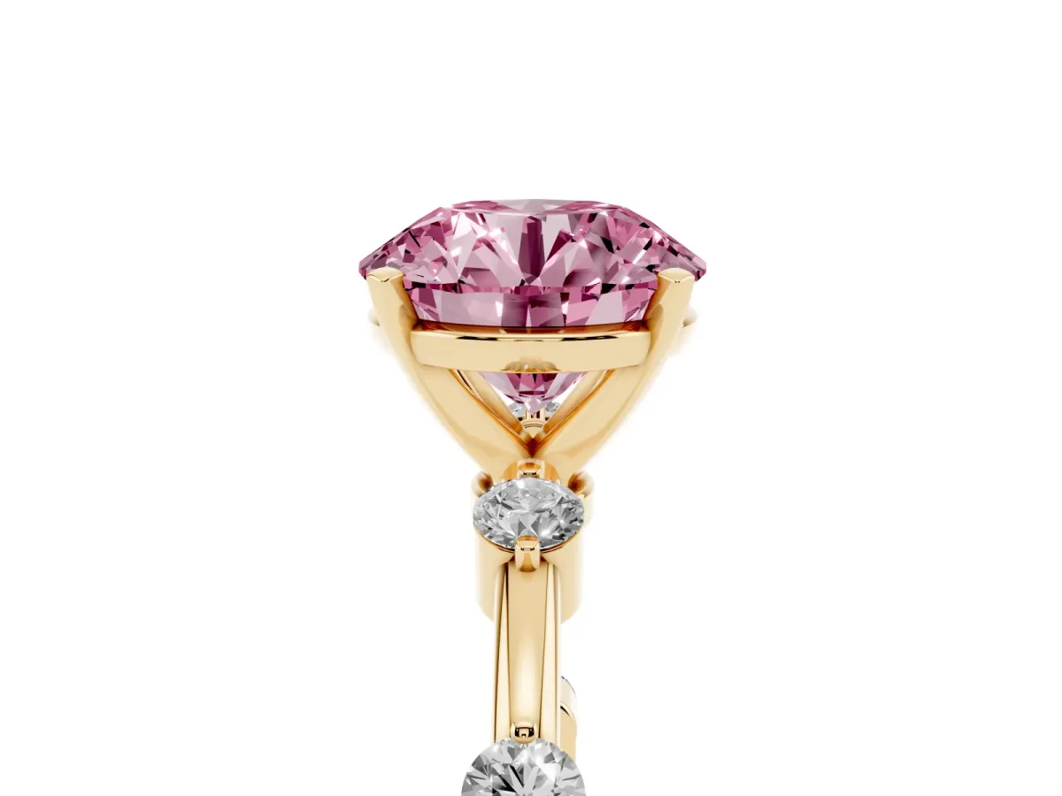 Fancy Pink Round Cut Solitaire Diamond Ring with Bezel Set Side Stones and Prong Setting Yellow gold