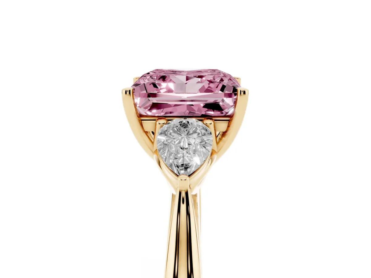 Fancy Pink Three-Stone Princess Cut Brilliant Diamond Solitaire Ring with Tapered Band and Four-Prong Setting Yellow gold