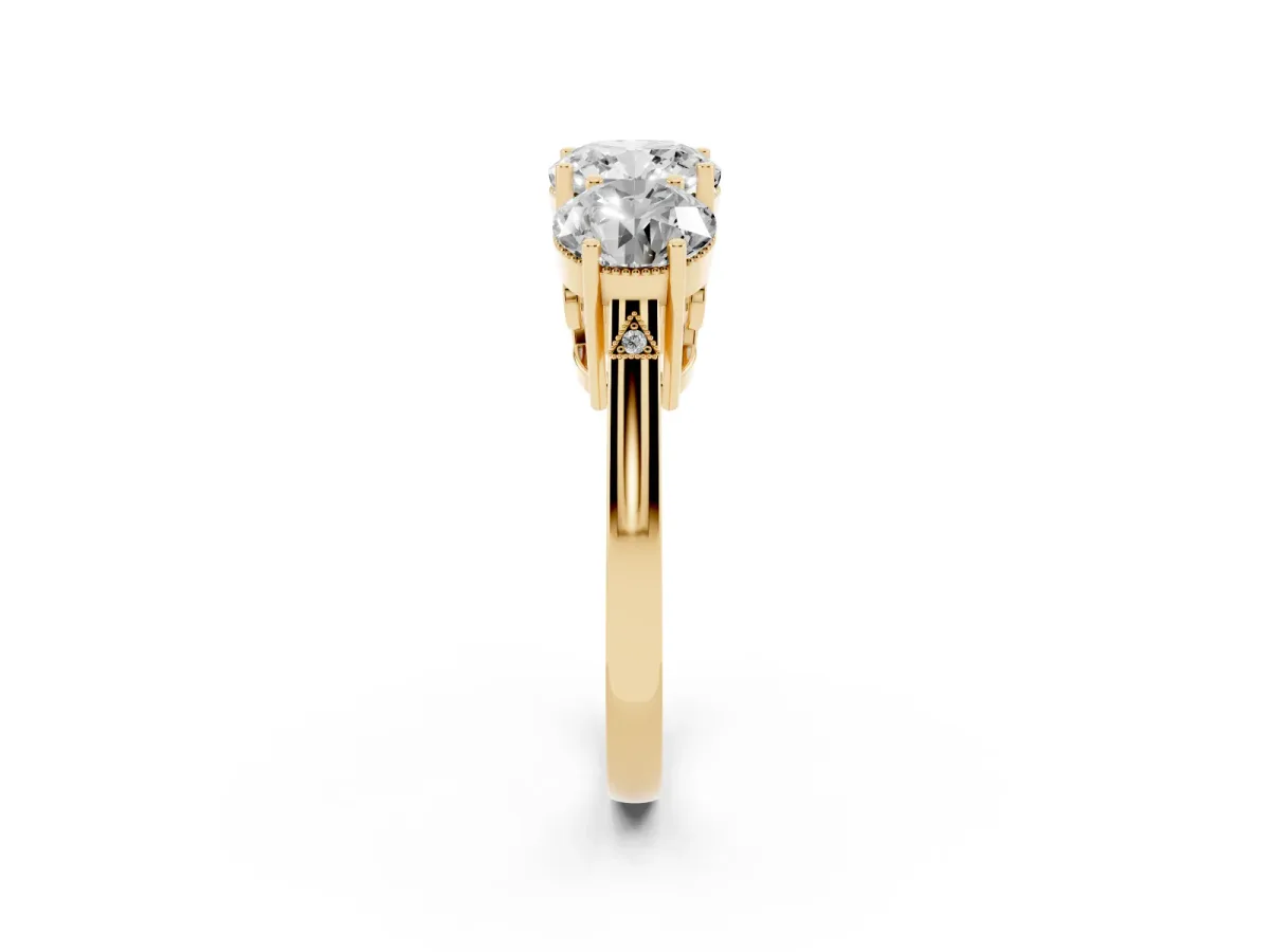 Three-Stone Cushion Cut Diamond Engagement Ring with Prong Setting on a Classic Band Yellow gold