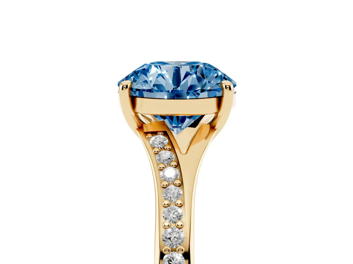 Fancy Blue Round Cut Diamond Solitaire Ring with Pavé Band and Prong Setting Yellow gold