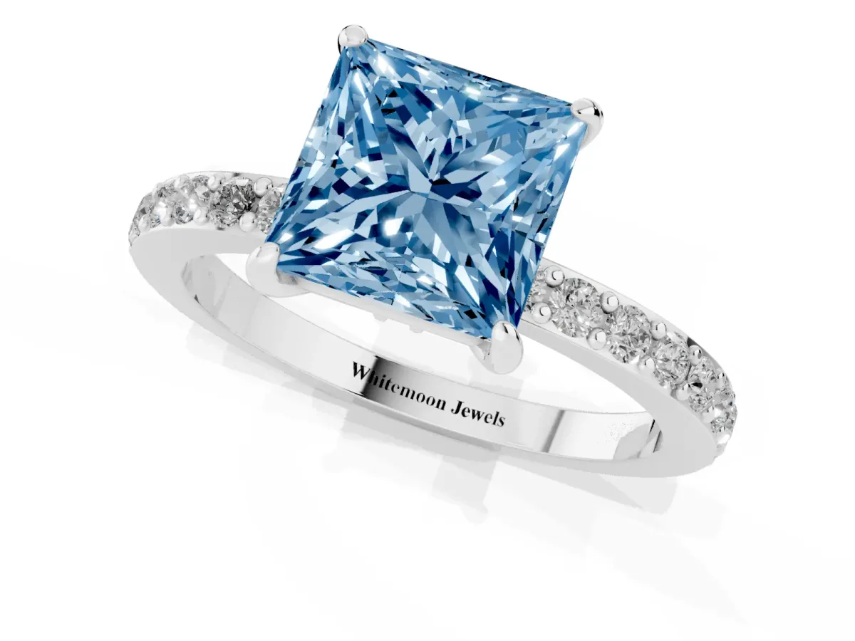 Fancy Blue Princess Cut Diamond Pavé Engagement Ring with Round Accents and Prong Setting Platinum