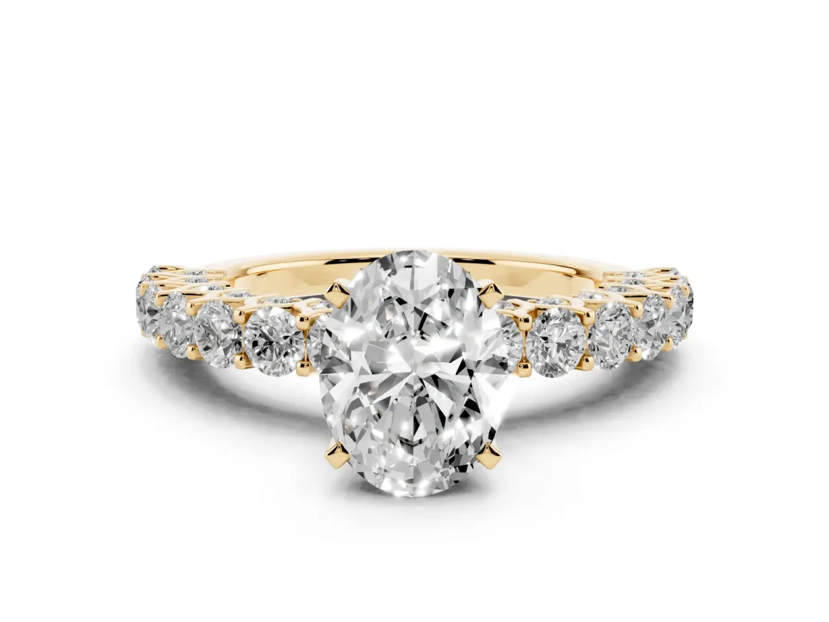 Oval Cut Diamond Solitaire Ring with Shared Prong Pavé Band and Four-Prong Setting Yellow gold