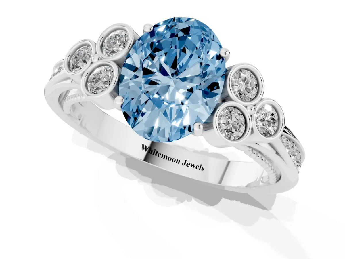 Fancy Blue Oval Cut Cut Diamond Engagement Ring with Bezel Set Round Side Stones and Prong Setting Silver