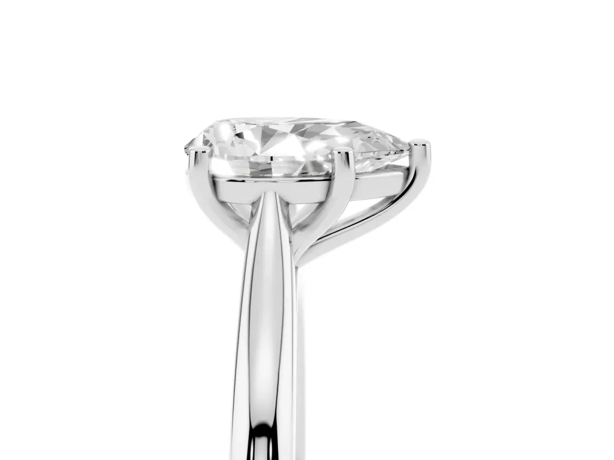 Pear Cut Cut Solitaire Ring with Cathedral Band and Four-Prong Setting Silver